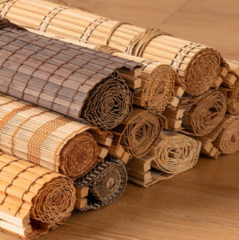 Rolled woven bamboo shade materials in light and dark finishes