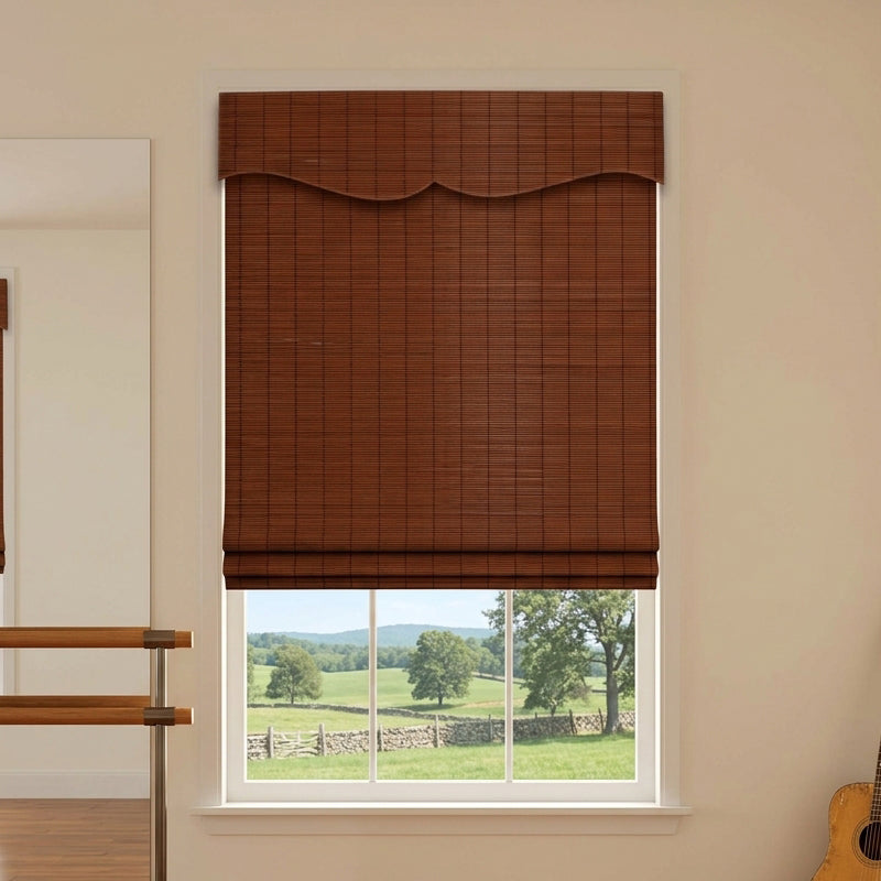 Brown bamboo shade with a shaped valance above a window